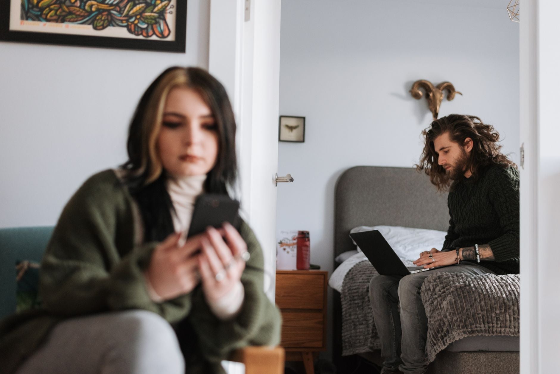 Person looking anxiously at their phone waiting for a reply, illustrating situationship uncertainty